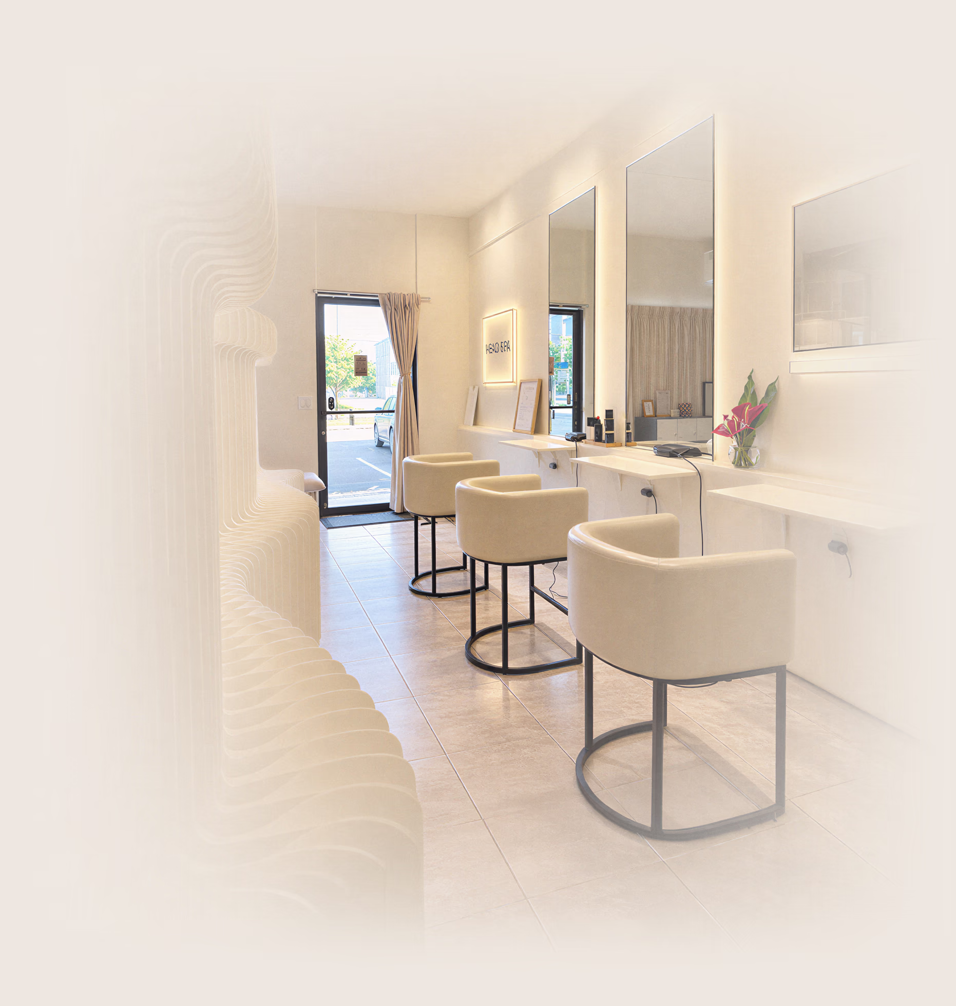 Mirrors and cream-colored chairs in the spa interior.